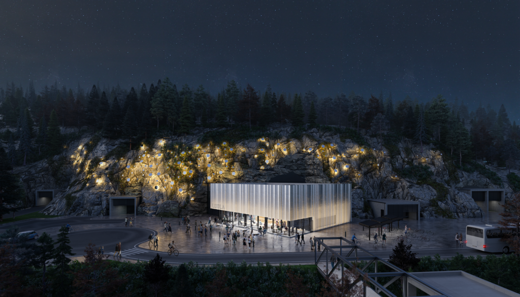 Havainnekuva Luolan sisäänkäyntirakennuksesta yövalaistuksessa