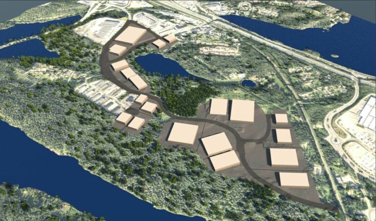 Havainnekuva, jossa näkyy vaaleita rakennuksia ja vihreitä metsäalueita.